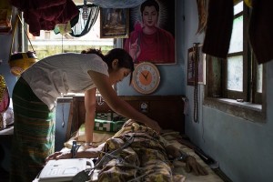 Dr Ei Thuzar Ag performs an electrocardiogram on a patient at Damaparla Monastery, East Dagon township (Photo: Whitney Light)