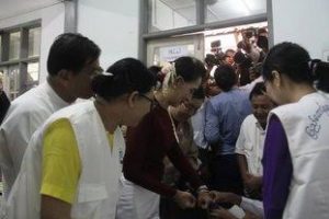 Suu Kyi's finger is marked with indelible ink as part of the voting process. (PHOTO: DVB)