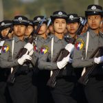 Police women march during the Grand Military Review Parade ceremony to mark the 67th Myanmar Independence Day in Naypyitaw