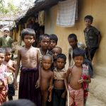 Rohingya children pose for the camera at the Kutupalong refugee camp