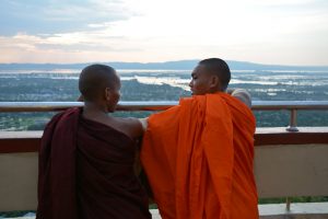 Young monks enjoy the view from Mandalay Hill. (Colin Hinshelwood/ DVB)