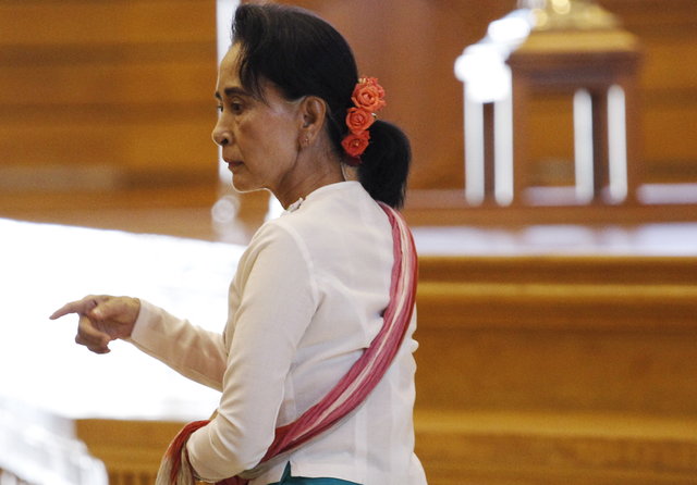 Suu Kyi gives up two ministerial posts
