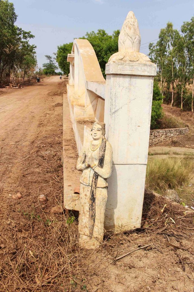 A statue of a woman with long hair marks the first “Gold Hair Bridge” built with hair donations. (Photo: Libby Hogan / DVB)