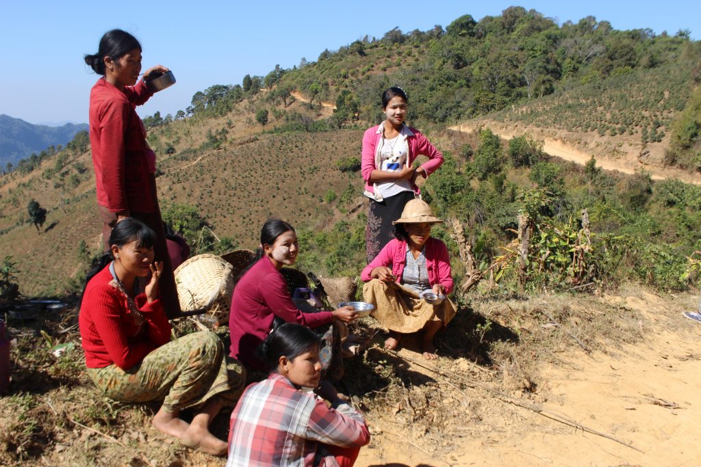 Women take a rest on the side of the road. Many women and families have been forced to flee and leave their farms due the fighting in northern Shan State. (Photo: Libby Hogan / DVB)