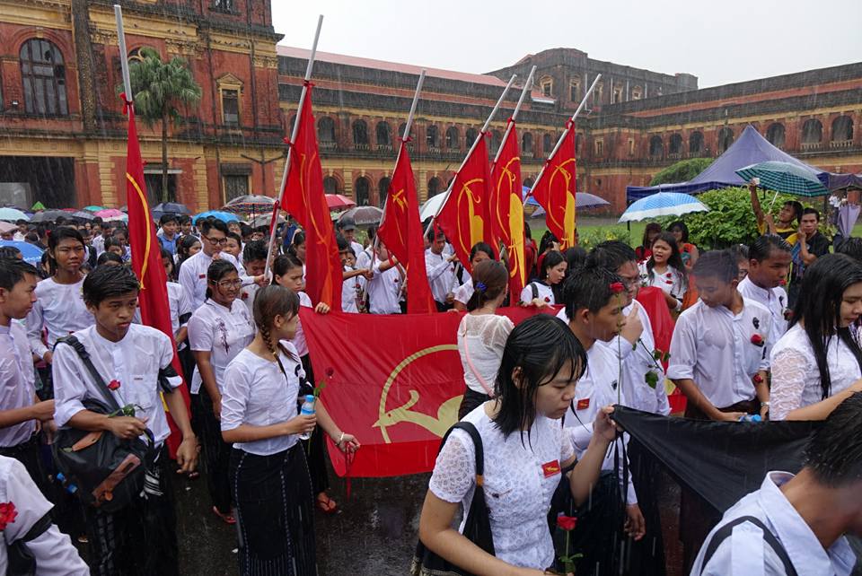 Students march in the rain in Rangoon to mark Martyrs' Day on 19 June 2016.