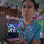 daw_mya_mya_aye_showing_picture_of_her_grandson_myat_ko_ko_who_died_for_electrocution_and_his_mother
