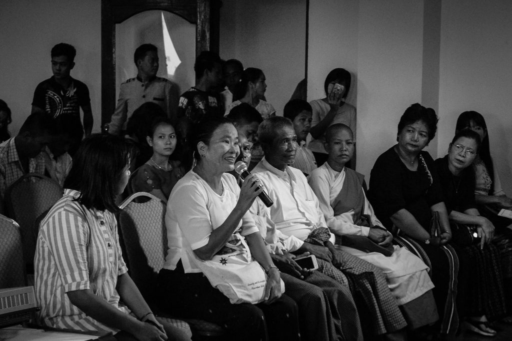 A lady asks a question about domestic violence at a joint conference held by Akhaya Women and Legal Clinic Myanmar in Rangoon on Saturday. (Photo: Libby Hogan / DVB).