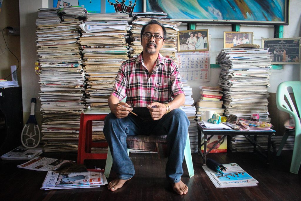 Political Cartoonist Soe Thaw Dar at home in his studio. (Photo: Libby Hogan / DVB)
