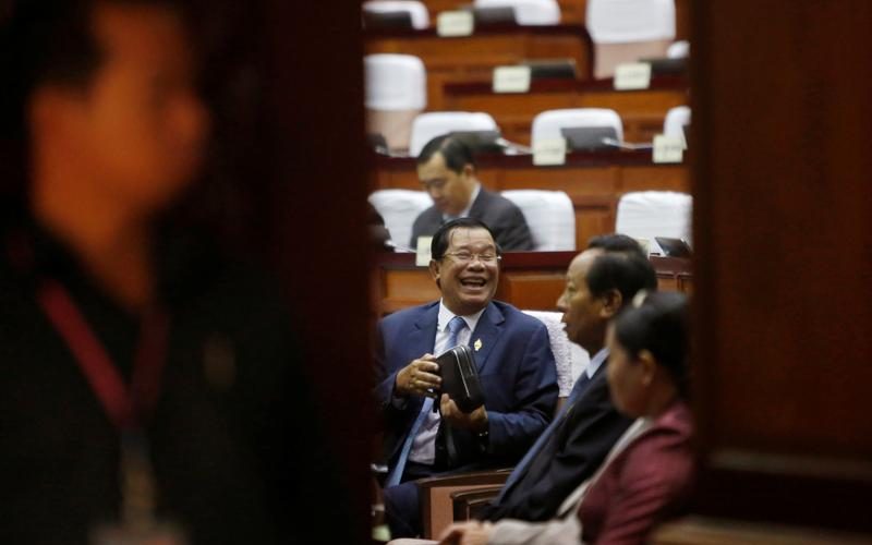 Cambodia MPs back change that bars leader’s rival