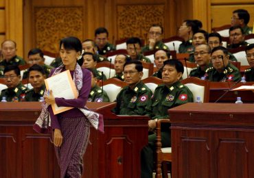 In speech marking a year in office, Suu Kyi admits reforms have been slow