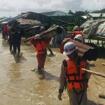 Workers-carry-roofing-materials-after-damages-caused-by-floods-in-Hinthada-Township-Credit-CJ