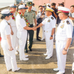 Burma Navy personnel greet their Chinese counterparts at Thilawa Port in Yangon on Nov. 27. (Credit- Regime media)