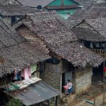 FILE PHOTO: Refugees who fled Myanmar are seen at their stilt houses at Mae La refugee camp, near the Thailand-Myanmar border in Mae Sot district