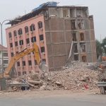 The Great Wall Hotel is being demolished by rescue teams to recover bodies under the rubble in Mandalay on April 9.